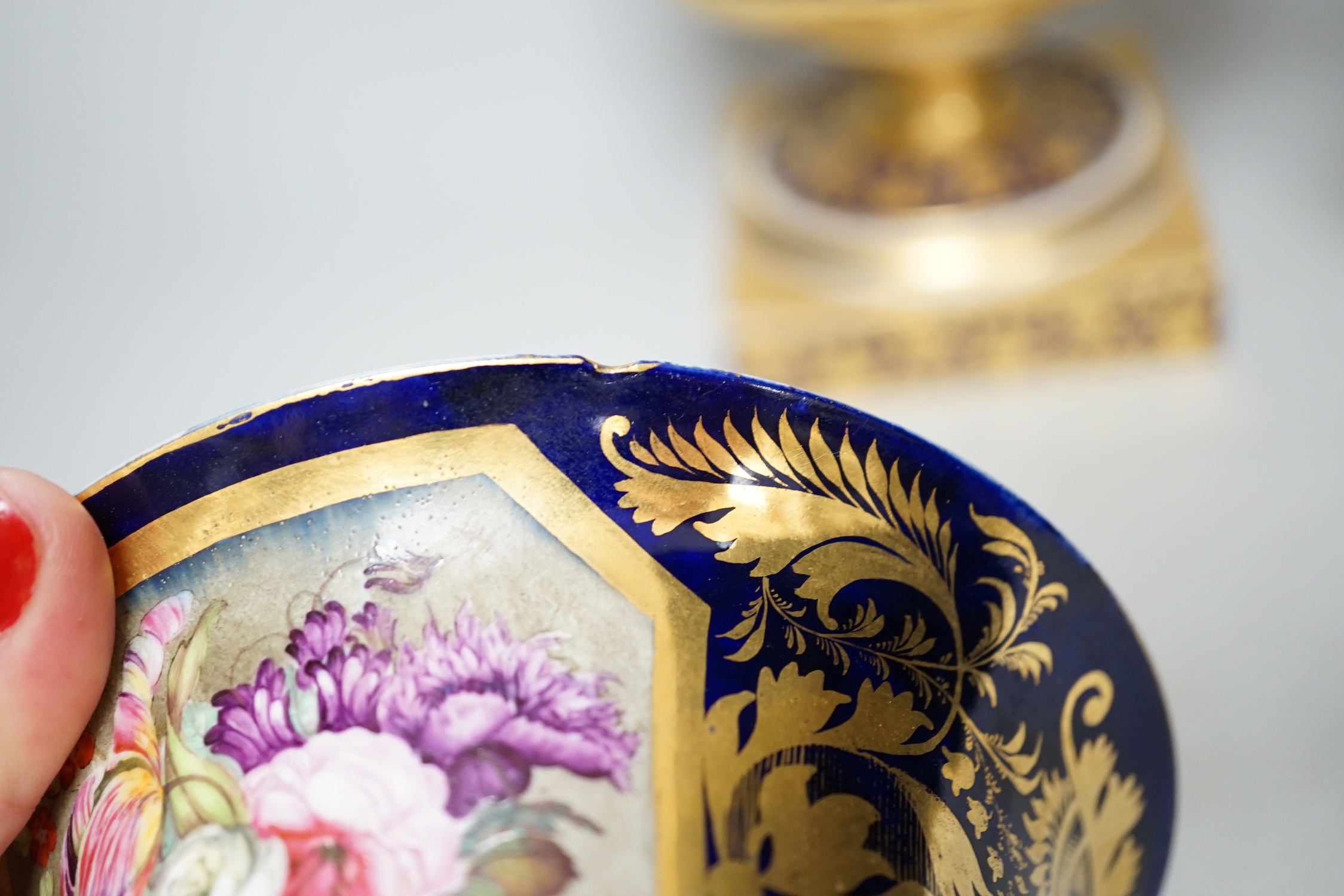A pair of Derby flower basket painted urns, c.1810, and a larger Derby urn and cover, first quarter 19th century, latter 30cm
